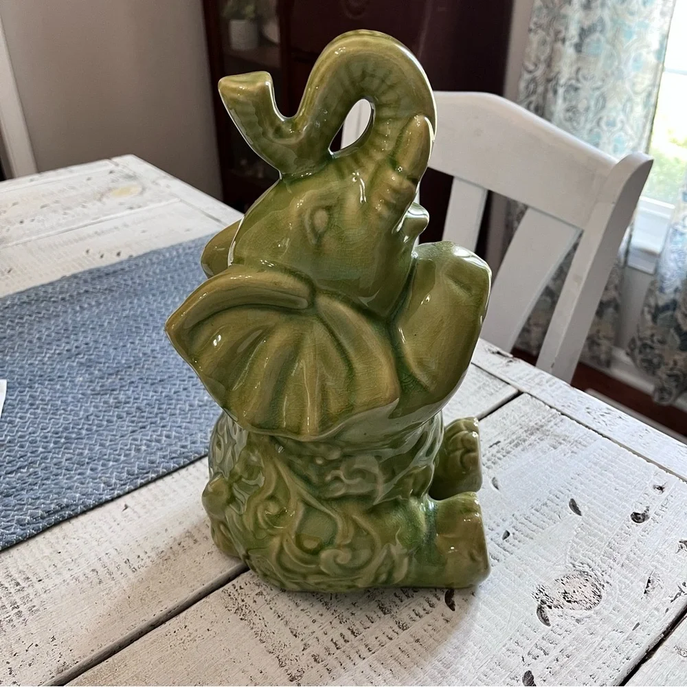 Elephant ceramic- Green Glaze Sitting with Floral Design 10 1/2” euc